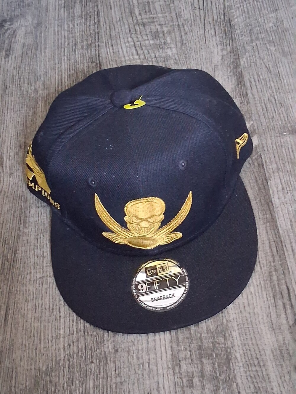 New Era Black and Gold Embroidered Crest Snapback